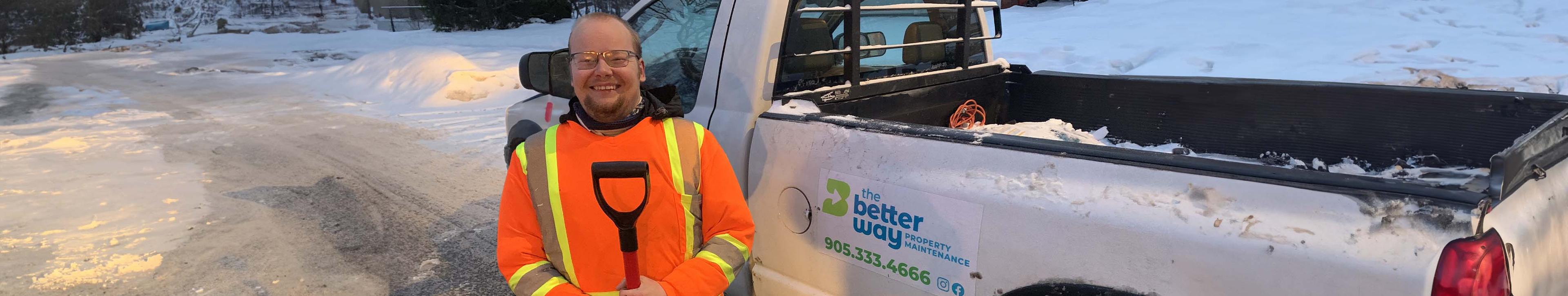 The Better Way team member holding snow shovel