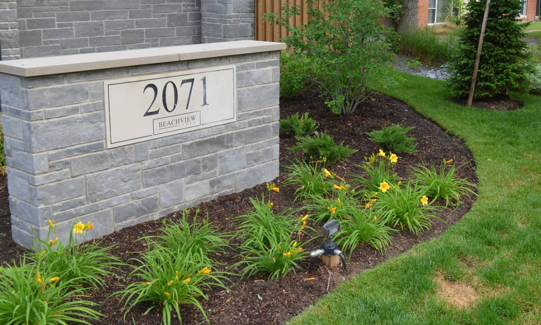 Image of a maintained garden in front of commercial building