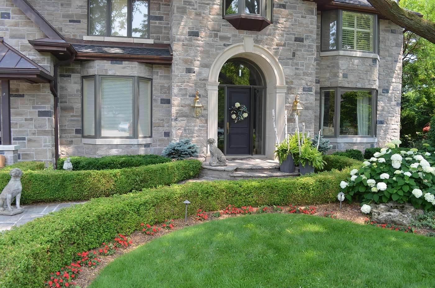 Freshly trimmed bushes in front of house